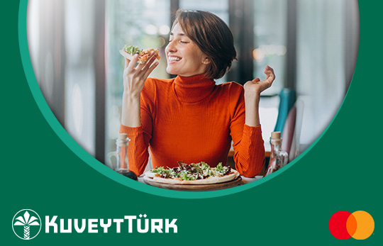 a woman eating on the restaurant