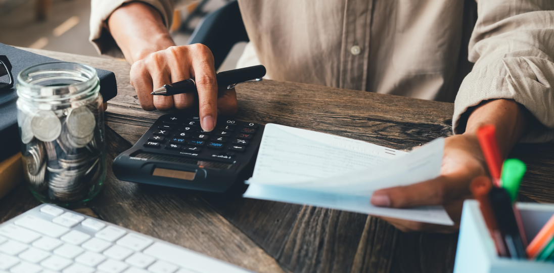 customer calculating their payments with a calculator