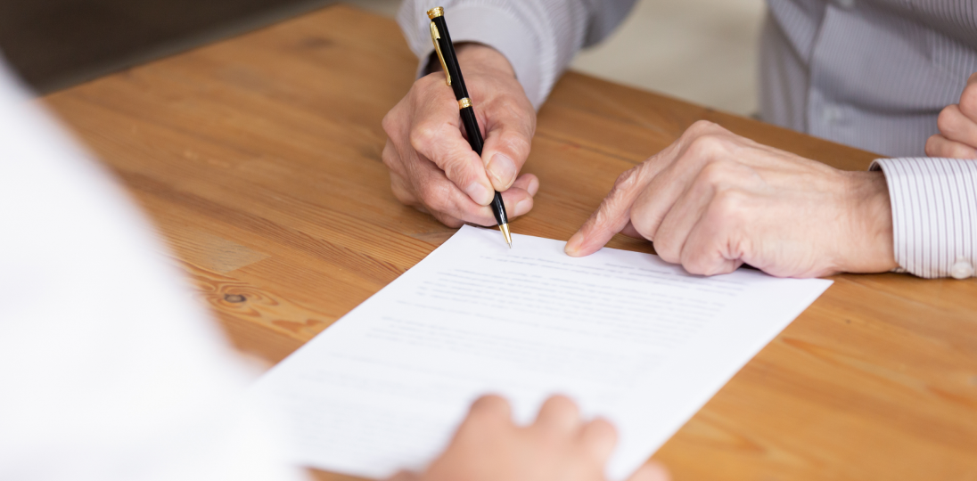 two people filling out forms