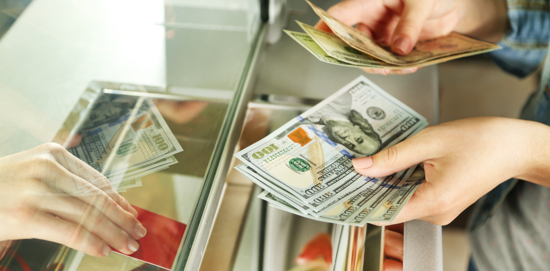 person who buys and sells foreign currency
